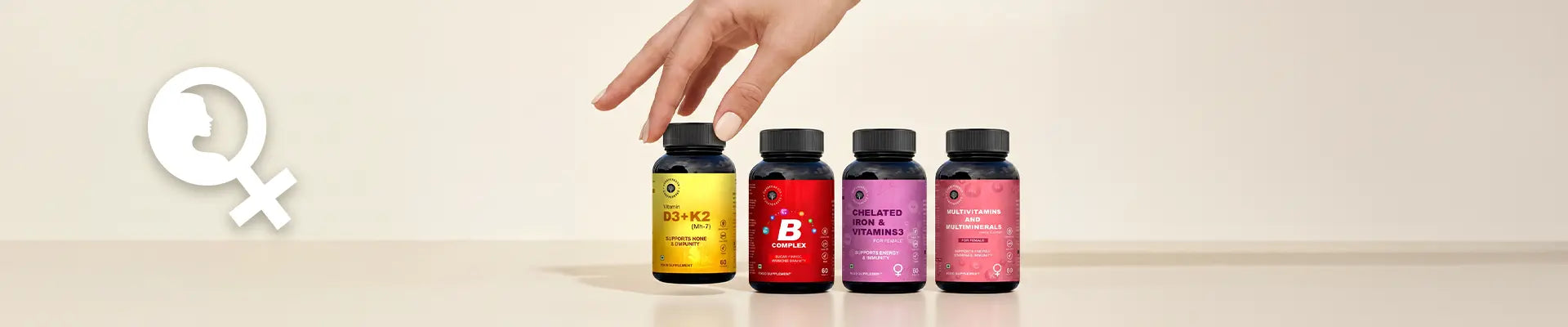 Hand reaching towards a row of colorful supplement bottles on a beige background
